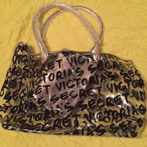 Victoria’s Secret plastic tote with wristlet.